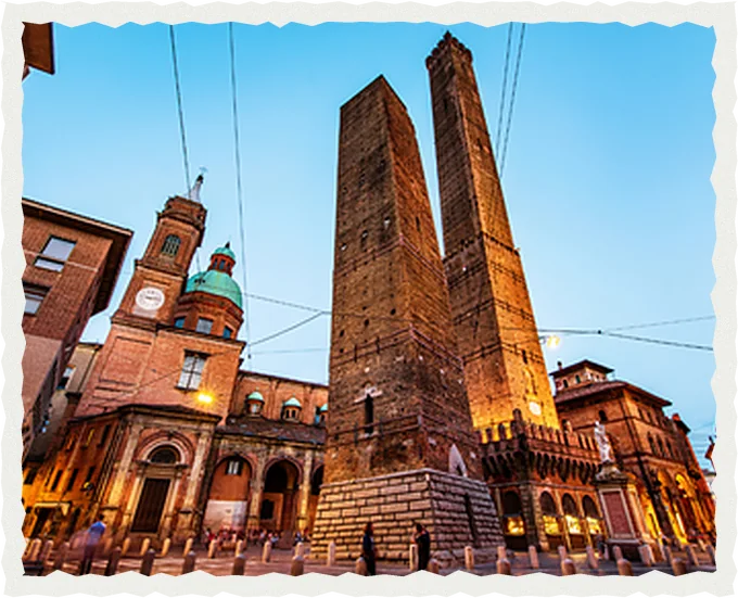 The Asinelli and Garisenda towers in Bologna, Italy, at sunset