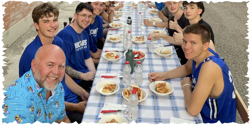 NBC basketball travel team at an outdoor team dinner in Italy