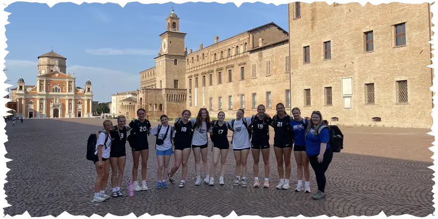 NBC volleyball travel team in an Italian town square during their July 2026 tour